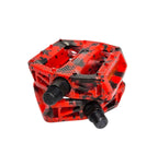 PEDAL PLATAFORMA 9/16 EM NYLON ESFERADO CAMUFLADO COM REFLETOR PRETO/VERMELHO