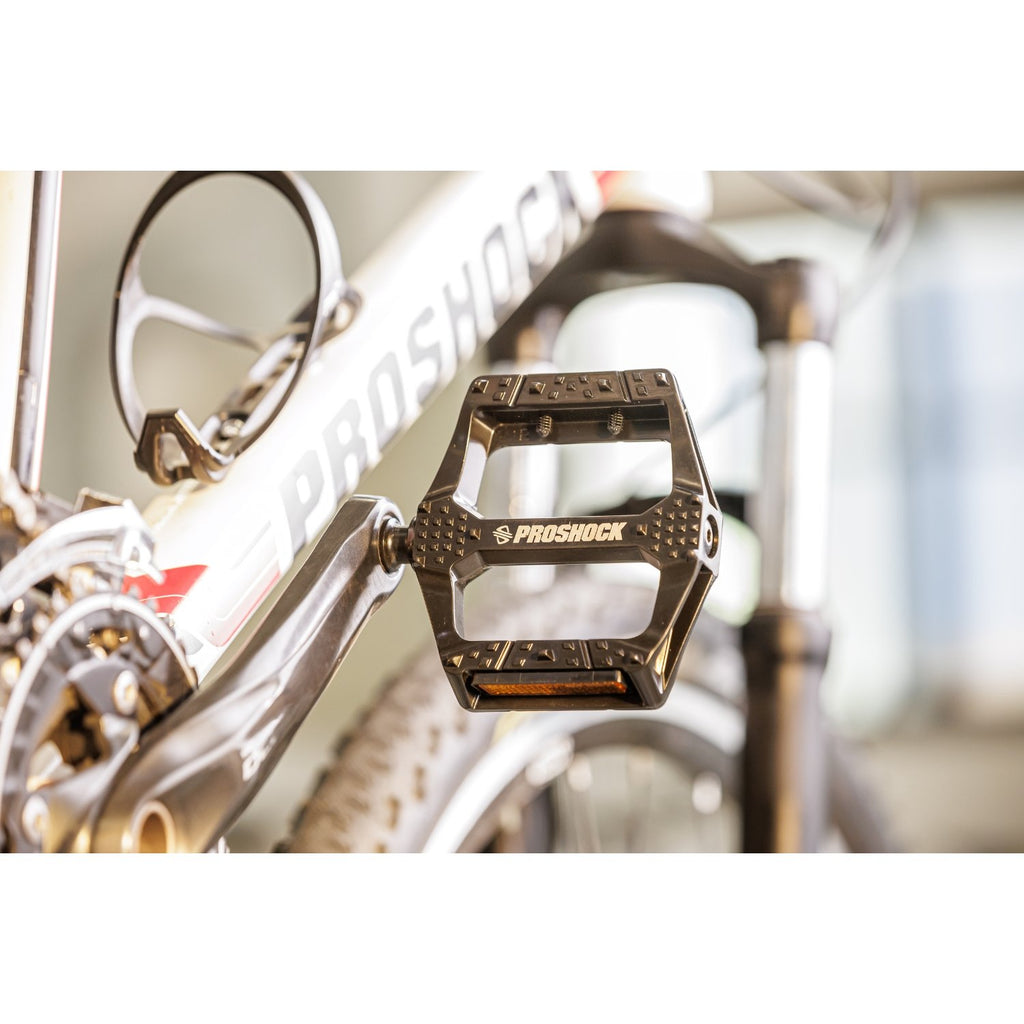 PEDAL PLATAFORMA PROSHOCK ALUMINIO EIXO CROMOLY ROSCA 9/16 PRETO