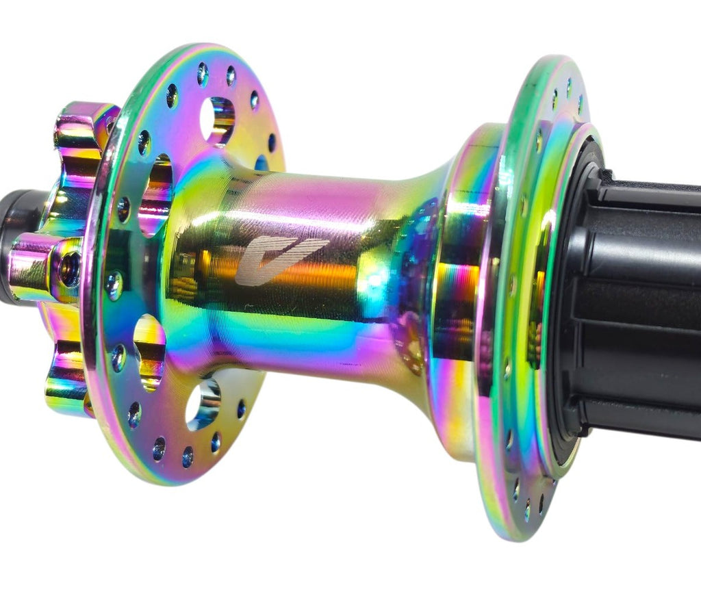 CUBO TRASEIRO VELOFORCE BARULHENTO 12V 10X135MM 36 FUROS EIXO MACIÇO RAINBOW