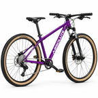 Projeto MTB Absolute Nero 5 XS roxa com pneus bege, transmissão 1x9 e peças pretas, vista traseira